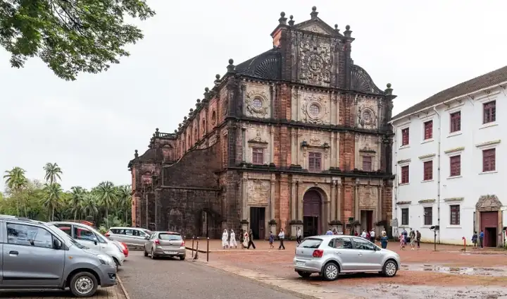Basilica of Bom Jesus and vehicles parked infront