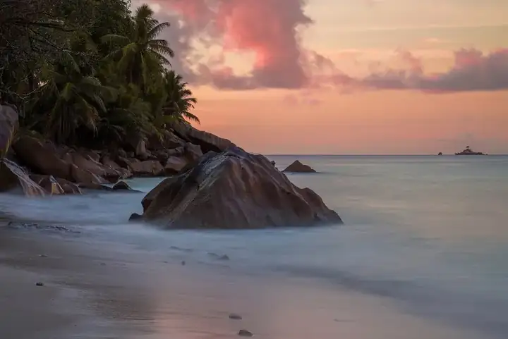 Granite rock in La Digue Island at sunset Photo by Giles Laurent