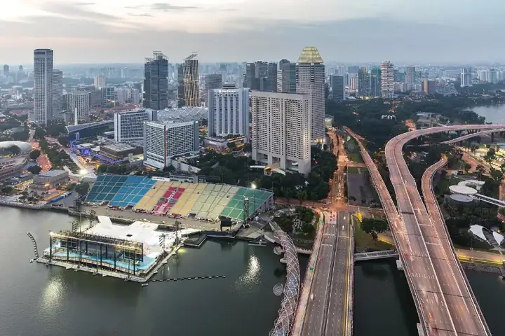 Floating Platform and illuminated East Coast Parkway seen from the sky observation deck of Marina Bay Sands Singapore