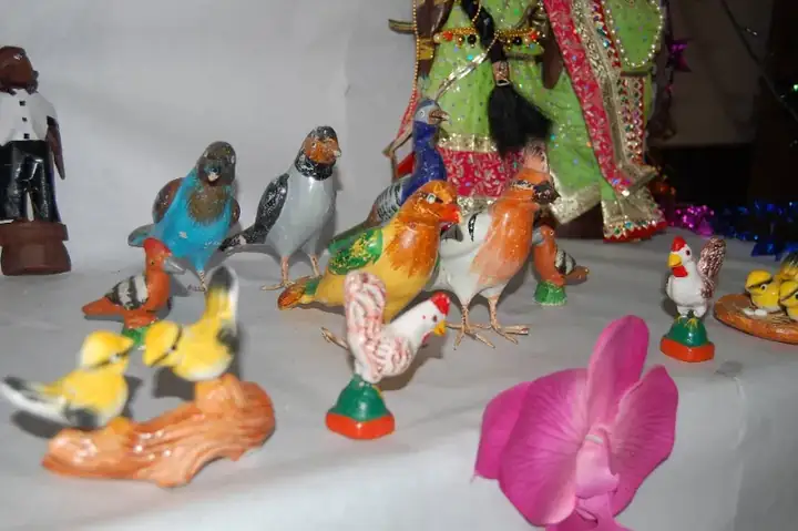Birds in a Golu display over Hindu Navaratri festival Kolu dolls